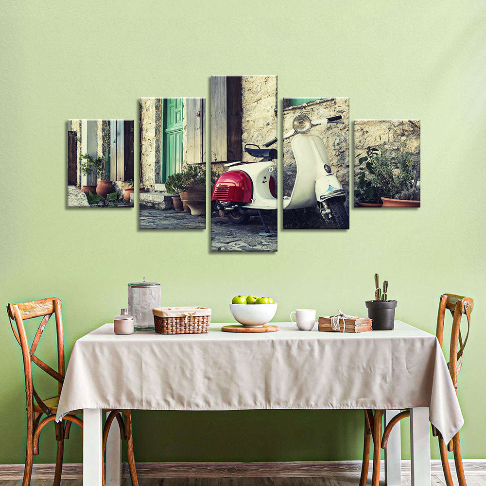 Old scooter in street of Karpathos Canvas Wall Art