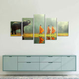 Elephant Walking with Monks Canvas Wall Art