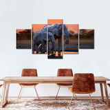 Elephants Walking at Sunset Canvas Wall Art