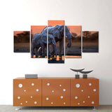 Elephants Walking at Sunset Canvas Wall Art