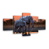 Elephants Walking at Sunset Canvas Wall Art