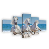 Three White Horses Running On The Beach Canvas Wall Art